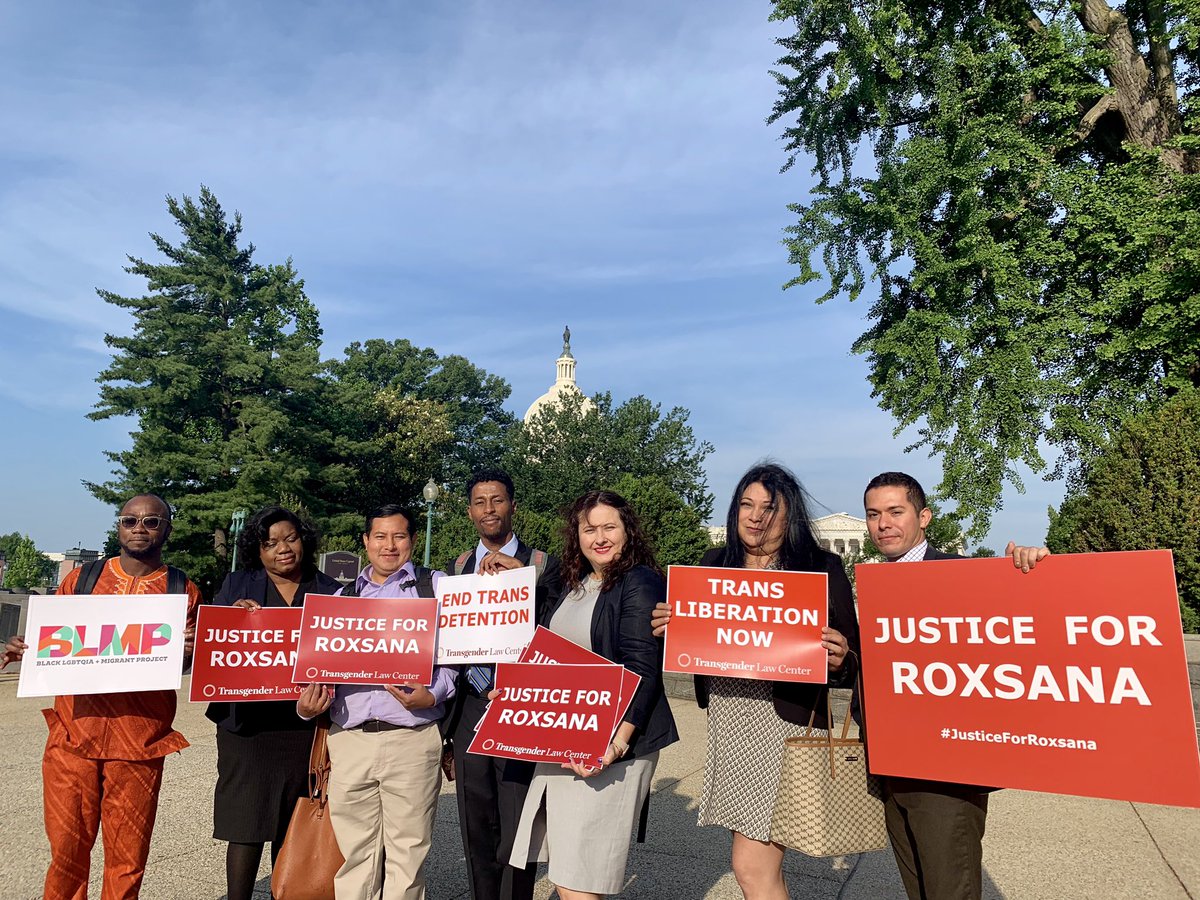 Seven LGBT people of color stand in front of US Capitol holding signs reading "Justice for Roxsana," "End Trans Detention," "Trans Liberation Now," and BLMP