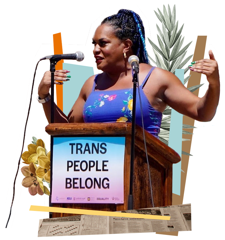 A feminine person standing behind a podium that says "Trans People Belong" gesturing to themselves 