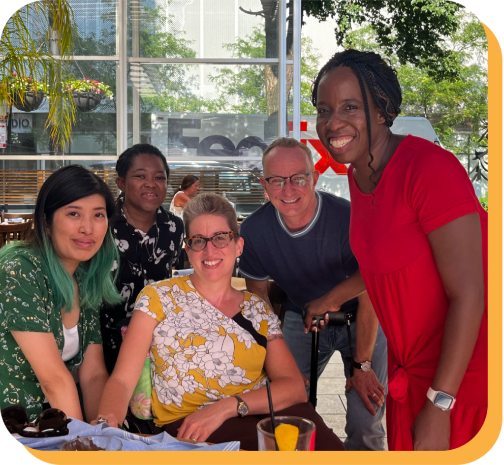 A multi-racial group of Chicago based disability organizers and DP staff enjoying each other's company.